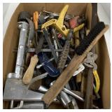 Assorted box of tools including caulk gun, file