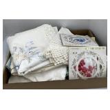 Assorted embroidered and crocheted table covers