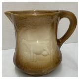 Brown Ironstone creamer with embossed cow  6.5?
