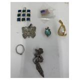 Assorted charms and ring
Costume jewelry