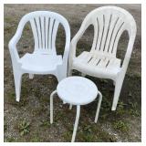 White plastic outdoor chairs and table