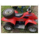Battery powered kid four wheeler with spare tire