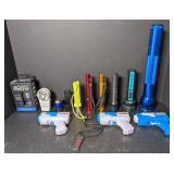 Lot of flashlights & water guns.