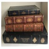 4 faux book storage boxes of varying size and