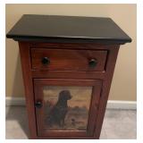 Night stand with picture of dog and duck on