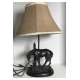 Table lamp with metal base depicting little girl
