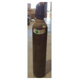 Tank of compressed gas marked stargold NOS