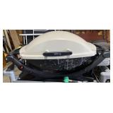 Weber portable grill, 32" W x 16" H.