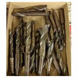 Flat of various large machine drill bits