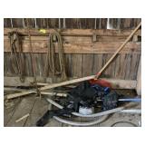 Contents of corner including rope, wood scrap and