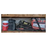 Contents of shelf. Water cooler, lunch box,