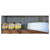 Contents of shelf. Cans of casting sand & roll of