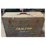 Skilsaw tool box containing assorted items such