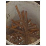 Bucket of metal rods