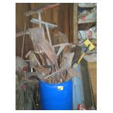 Bin of rakes, shovels, and more