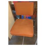 Orange swivel office chair