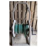 Suncast Hosemobile with green garden hose