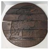 (R) Wooden cheese barrel top with carved image of