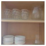 Contents on Shelf including Glass Pitcher, Mugs,