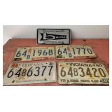 Lot of Vintage license plates and toy car