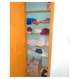 (B) Contents of closet including various linens