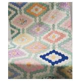 (AO) Old quilt. In ok condition.  It is worn in
