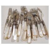 (AO) Mother of pearl serving pieces and forks.