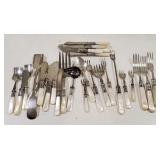 (AO) Mother of pearl silverware pieces.