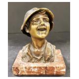(AO) Metal statue on a marble piece.   It