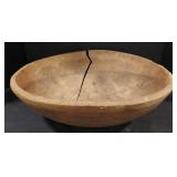 (AB) Primitive carved wood bowl with crack.