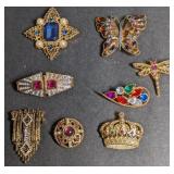 Costume brooches, gold in tone.