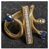 Gold ring w/ blue accent stones marked "18kt".