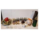 Lot of assorted candles, candle holders, and