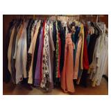 Row of Sweaters, Blouses, & Pants in Various