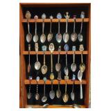 Three sets of souvenier spoons with wall hanging