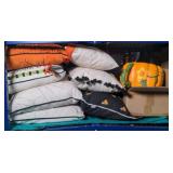 Contents of shelf w/ various Halloween pillows