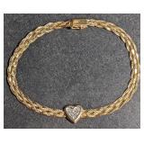 Gold heart bracelet marked "14k". Total weight