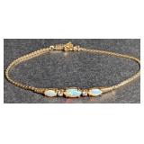 Gold opal bracelet marked "14k". Total weight