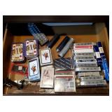 Assorted drawer contents, including playing