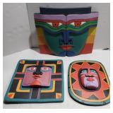 Lot of wooden painted decorative faces, wall