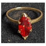 Gold ring w/ red marquise cut stone marked "14k".