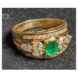 Gold ring marked "750" w/ green accent stone.