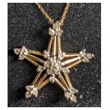 Star necklace marked "GTR 10kt". Total weight