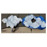 Two inflatable pool loungers, one swan, one ring,