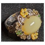 Silver ring with gold-tone accents, yellow