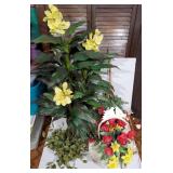 Lot of artificial plants and flowers in baskets
