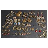 Gold tone earrings. Pierced.