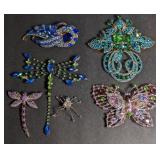 Costume jewelry brooches.