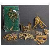 Gold tone costume jewelry. Brooches, bracelet,