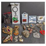 Keychains, pins, brooches. India, New Zealand,